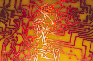 Wall Mural - Handmade circuit board. industrial background. red soldered tracks on textolite