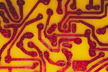 Wall Mural - Handmade circuit board. industrial background. red soldered tracks on textolite