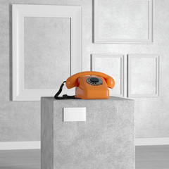 Poster - Orange Vintage Styled Rotary Phone over Pedestal, Stage, Podium or Column in Art Gallery or Museum. 3d Rendering