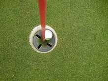 High Angle View Of Golf Ball In Hole