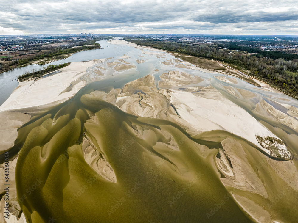 Low water level in Vistula river near Warsaw, capital of Poland. Europe is drying up, level of water in rivers and lakes is alarming - obrazy, fototapety, plakaty 