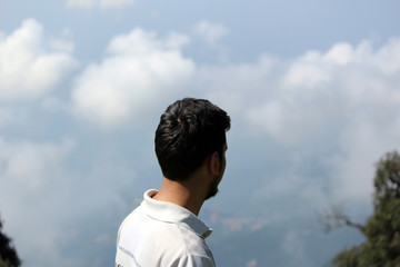 young man looking at sky