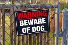 WARNING BEWARE OF DOG - Sign On Chain Link Fence.
