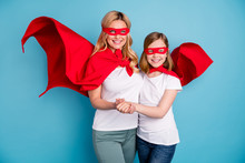 Photo Of Funny Cool Mom Lady Little Daughter Spend Time Together Carnival Super Hero Costumes Hold Arms Cape Flying Wear S-shirts Red Coat Masks Isolated Blue Color Background