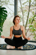 © Катя Іваськевич - young woman doing yoga. yoga at home. meditation at home.