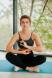 © Катя Іваськевич - young woman doing yoga. yoga at home. meditation at home.