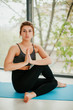 © Катя Іваськевич - young woman doing yoga. yoga at home. meditation at home.