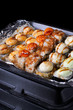 © kcuxen - Set of sushi rolls in disposable containers. Food delivery service concept
