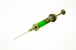 
Vintage syringe with green vaccine in steam punk style closeup
