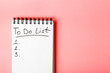  To do list in a white notebook on a pink background. Copy spase.