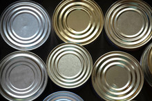 Silver Food Steel Cans In Cardboard Box Closeup Food Delivery