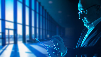 Poster - a man with a smartphone in his hands in a large empty hall. flight delay. irregular working hours. a