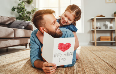 Wall Mural - little girl congratulating dad with fathers day.
