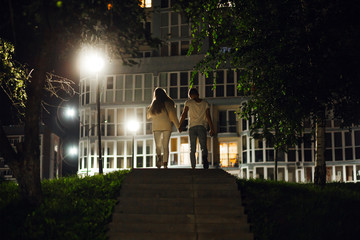 a couple in love on a walk through the city at night