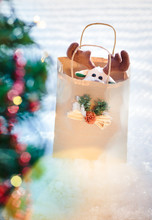 Reindeer Toy In Paper Bag