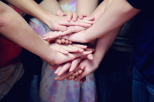 Midsection Of Children Stacking Hands