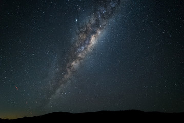 Wall Mural - A night time photo of the Milky Way galaxy against a dark starry sky in the southern hemisphere of Australia