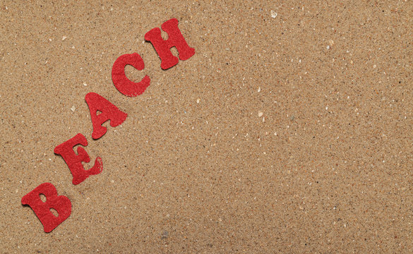 inscription beach in the sand, close-up
