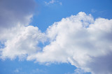 Fototapeta Na sufit - White clouds on blue sky background, close up
