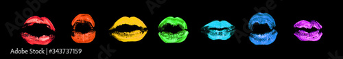 Fotografía Rainbow color lipstick kiss print set on black background isolated close up, col