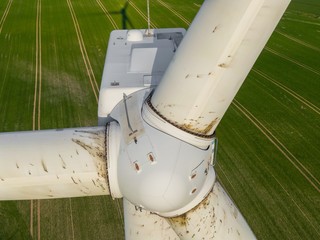 Wall Mural - 
Wind turbine inspection of the rotors and the turbine close up detail shot with a drone - oil emerges from the rotors  - nature pollution