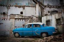 Classic American Car On Derelict Buidling Lot In Havana Cuba