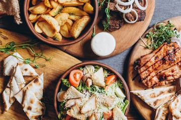 delicious European and Slavic cuisine on the big table waiting for guests. table with food, top view