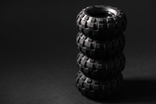 Stack Of Lego Tires Close Up Over Black Background