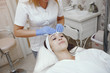 © hetmanstock2 - Cosmetologist treats client's skin. Woman with cosmetologist. Lady in a beauty studio.