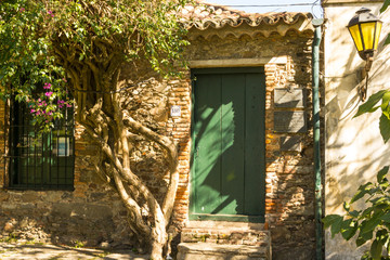 Wall Mural - Facade of an old stone building in Colonia del Sacramento, Uruguay. It is one of the oldest towns in Uruguay