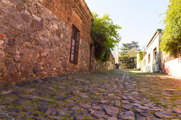 Wall Mural - Street of Sighs, in the historic center, a World Heritage Site by Unesco in 1995. The houses are from the 18th century. Uruguayan city of Colonia del Sacramento