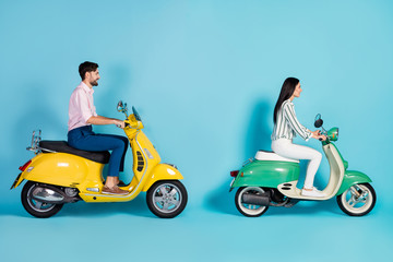 Wall Mural - Full size profile side photo of positive cheerful man girl drive yellow green chopper enjoy freedom journey wear white striped shirt pants trousers pink isolated over blue color background