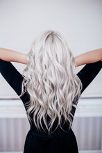Female Back With Silver Grey Ash Blonde Curly Wavy Long Hair In Black Dress 