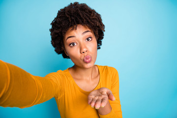 Poster - Self-portrait of her she nice attractive lovely sweet pretty cute cheerful wavy-haired girl sending you air kiss affection feelings isolated over bright vivid shine vibrant blue color background