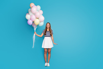 Sticker - Full length photo of pretty beautiful lady hold many colorful air balloons visit best friend birthday party wear striped t-shirt white short skirt shoes isolated blue color background