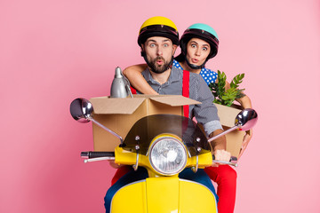 Sticker - Portrait of his he her she nice attractive funny amazed couple driving moped hurry-up rush changing place of living pout lips isolated over pink pastel color background