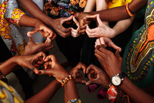 Hands In The Form Of Heart Of Happy Group Of Multinational African, Latin American And European People Which Stay Together In Circle