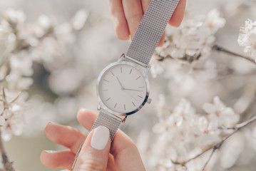 Wall Mural - Beautiful white watch in woman hands