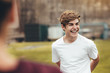 © Jacob Lund - Boy smiling during physical training class in high school