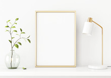 Interior Poster Mockup With Vertical Gold Metal Frame On The Shelf With Green Tree Branch In Vase And Desk Lamp On Empty White Wall Background. A4, A3 Size Format. 3D Rendering, Illustration.