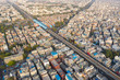 Aerial view of New Delhi public transport system crossing neighborhood, India.