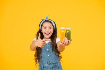 Supermarket promotion. Living healthy life. Vitamin juice. Fresh smoothie. Girl drinking orange fresh smoothie. Vegetarian concept. Smiling kid hold fruit smoothie bottles. Healthy food. Buy food