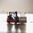 © Erik Isakson/Tetra Images - Forklift driver working in warehouse