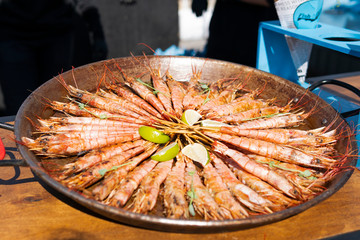 Close-up of ready to eat delicious grilled tiger shrimp with lime. Concept of healthy eating, dinner or lunch