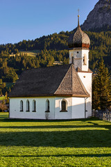 Wall Mural - Mariahilf chapel in Tannheim (Tirol, Austria) at spring sunrise