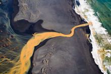 Aerial View Of Braided River Flowing Into Ocean