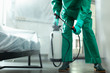 Specialist spraying chemicals from portable tank stock photo