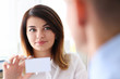 © H_Ko - Female hand in suit give blank calling card to male visitor closeup. White collar partners company name exchange executive or ceo introducing at conference product consultant sale clerk concept