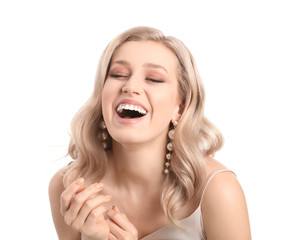 Wall Mural - Young blonde with beautiful hair on white background