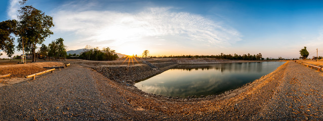 Poster - Panorama view of reservoir with mountain view at sunset